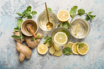 Lemon and ginger tea with honey. Healthy ingredients against cold. Top view image  with copy space. get rid of toxins and boost.