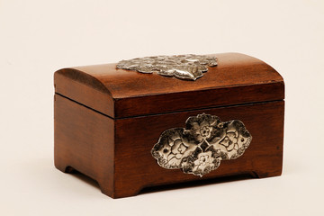 Jewelry box made of wood with additional workmanship and decorated. Wooden jewelry box. Wooden box made of aged wood.