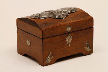 Jewelry box made of wood with additional workmanship and decorated. Wooden jewelry box. Wooden box made of aged wood.