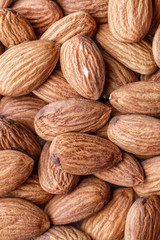 Organic almond nuts as background, top view. Healthy snack. For vegetarians.