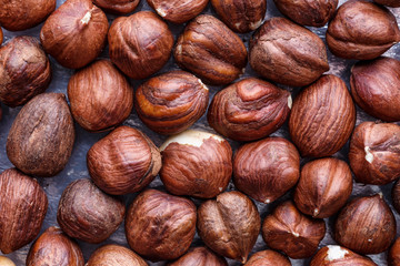 Hazelnut Background. Heap of peeled hazelnuts. Healthy snack, vegetarian food, beer snack