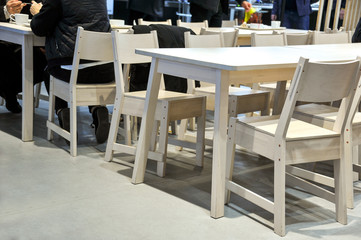 Chairs and tables in the interior. Elements of the interior. Close-up. Background without sharpness.