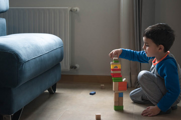 child playing with toy blocks