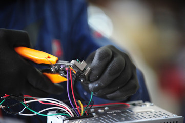 Electrical wire repairs in car audio.