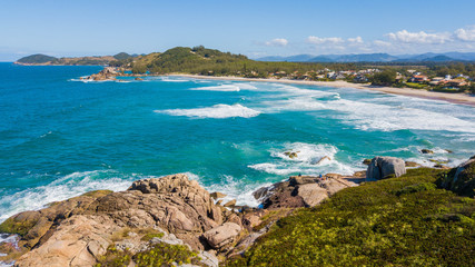 Fototapeta premium Aerial view of Barra beach - Garopaba. Beautiful natural beach in Santa Catarina, Brazil