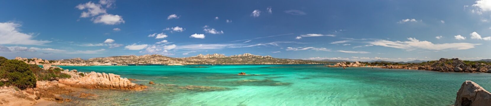 Panoramic view of the sunny beaches, and of the clear and transparent waters of the Maddalena island in Sardinia, Italy.
