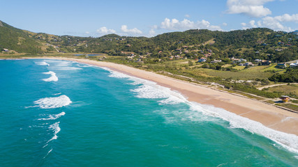 Aerial view of Silveira beach - Garopaba. Beautiful beach between mountains in Santa Catarina, Brazil