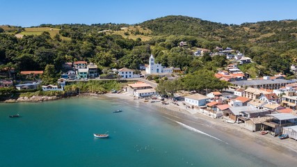 Fototapeta na wymiar Aerial view of the church and beach of Garopaba, in Santa Catarina, Brazil