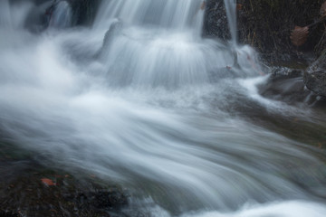 Silky, turbulent water of a small waterfall in Hebron, Connecticut.