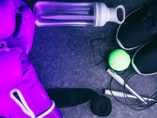sport sneakers, leather boxing gloves, jump rope, ball, water