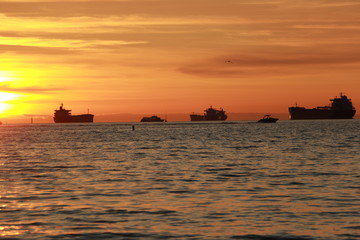 Fototapeta na wymiar Ocean and ships during sunset