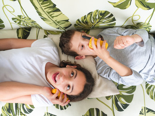 top view of two children playing with walkie talkie, communication concept