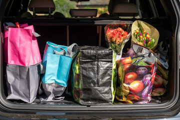 Hampshire,England, UK. 2020. Shopping bags and the weekly shop in boot of a car.