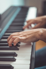 Woman and her piano in home
