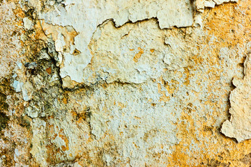 Texture of the old wall with rough peeled off paint