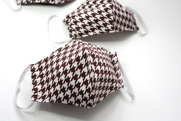 Handmade cotton face mask protective against dust and virus top view. Coronavirus preventive  cotton mask.  DIY concept.