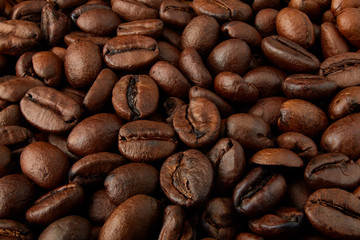 Coffee beans background close-up. Background of roasted coffee beans