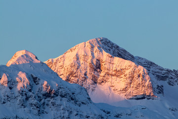 Mountain peak Škrbina sunlit in Bohinj