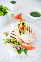 Burritos wraps with mushrooms and vegetables, traditional Mexican food.