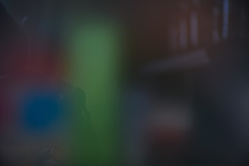 Colorful dark blurred background with spots, lines and patterns