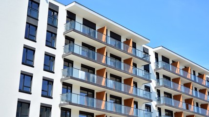 Modern condo building with big windows and modern facade.