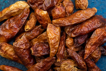 Detail of dried cayenne to add spice to food. Blue dark background