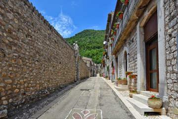 A narrow street between the old houses of a village in the province of Benevento, Italy