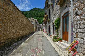 A narrow street between the old houses of a village in the province of Benevento, Italy