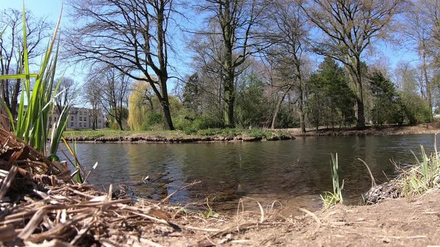 Flowing stream Moersbach in the city of Moers (Germany) in the park