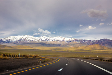 A Lonely Long Road with a Stunning Scenic Landscape View