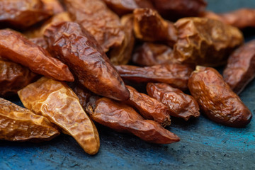 Detail of dried cayenne to add spice to food. Blue dark background