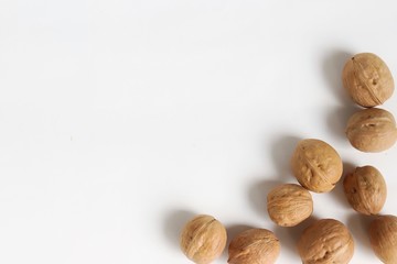 A white background on which walnuts are located