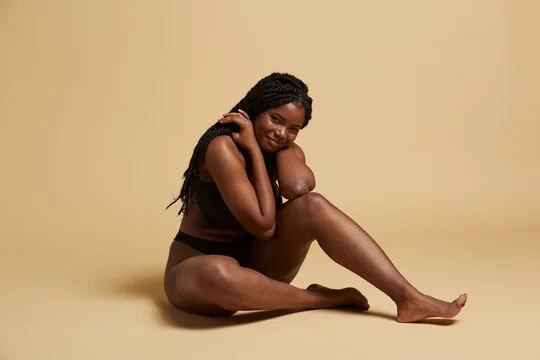 Curvy beautiful African American woman with braids in lingerie