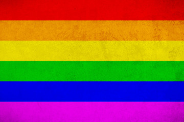 Rainbow flag grunge background, commonly known as the gay pride flag or LGBTQ pride flag