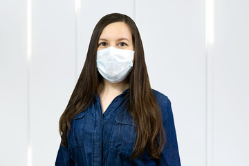 Woman wear protective face mask at home - protection against influenza virus.. Stop the virus and...