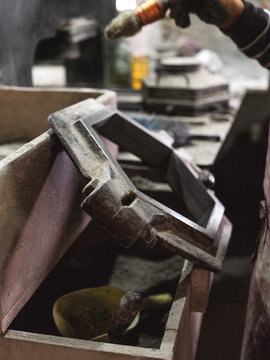 From above of big metal hexagonal shape for making tiles in workshop