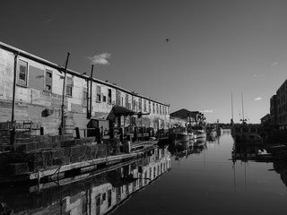 Old wharf in Portland Maine with reflections on a calm winter morning