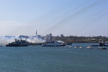 The large landing craft Caesar Kunikov and Azov are firing from Grad-M multiple launch rocket systems at the Navy Day parade in the hero city of Sevastopol, Crimea