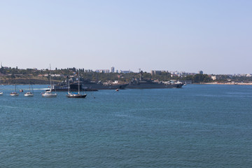 Fototapeta na wymiar Large landing ship Caesar Kunikov and Azov leave the Sevastopol bay at the parade on Navy Day, Crimea