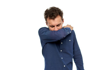 Young man coughing