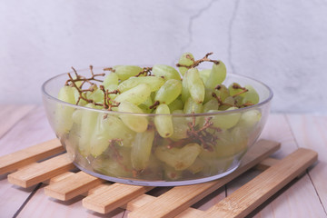 close up of grape fruit in a bowl on table