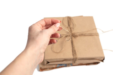 wrapped in kraft paper and tied with a ribbon isolated on white background