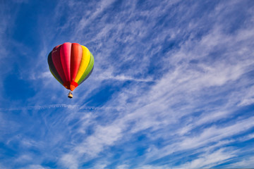Fototapeta na wymiar Hot air balloon flying.