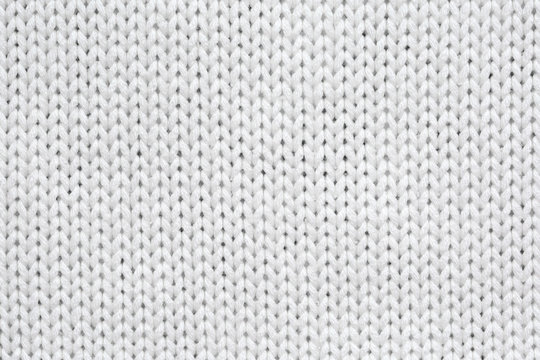 White knitted texture and background.