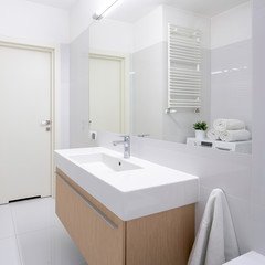Fototapeta na wymiar Simple bathroom with long washbasin