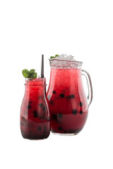 blueberry cocktail in tall glass and pitcher isolated on white background