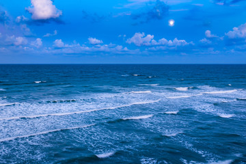 Fototapeta na wymiar Beautiful view of the sea with long exposure white waves washing the shore, Vama Veche, Black Sea, Romania