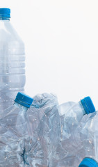 Empty plastic bottles on a black background Environmental and recycling