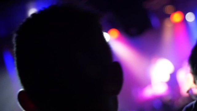 Man dancing in front row at a concert
