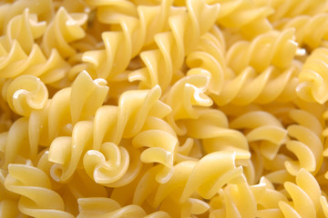 Fusilli. Pasta background. Dry pasta fusilli. Top view